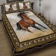 a bed covered in a blanket with horses on it