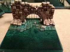 a miniature castle made out of bricks on a table