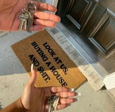 two hands holding keys in front of a door that says, don't touch us and smash it