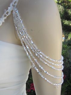 Handmade item Shoulder Necklace Bridal shoulder necklace 2 pieces per order. handcrafted beaded made to order Please get in touch for more information. Thank you so much for choosing my store. It is very importent to let my customers happy, so dont hesitate to contact me for your questions. Standart shipping I ship from Turkey , General delivery durations are USA : 12 /20 days Canada : 10/20days Australia: 15/25 days Bead Wedding Dress, Wedding Dress Straps, Strap Wedding Dress, Dress Embellishments, Pearl Applique, Pearl Straps, Detachable Wedding Dress, Wedding Anklets, Shoulder Epaulettes