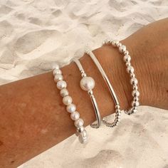 "This is a Sterling Silver Pearl Bracelet ,a very special Wedding Set Bridesmaid Gift .A romantic  Silver Pearls Bracelet Gift for the Bride and an unforgetable Jewelry Bridal Pearl for the Mother of the Bride . ⭐️YOU CAN ORDER ONE BY ONE OR IN SETS  KEY FEATURES :   * White Freshwater Pearls   * Pearls 10mm and 6mm   * Highest-quality Sterling Silver   * 3mm or 4mm Beads   * 5mm ans 6mm Beads   * Sterling silver Tubes   * Durable 1mm stretchy cord   * All  items feature a gift box and cleaning Elegant Pearl Jewelry, Silver Pearl Bracelet, Pearl Bracelet Wedding, Pearls Bracelet, Bracelet Set Silver, Wedding Bridesmaid Jewelry, Sterling Silver Bead Bracelet, Pearl Jewelry Sets, Jewelry Bridesmaid