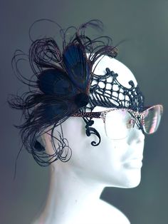 The beauty of peacock feathers in rare black shade combined with intricate black lace, designed to fit comfortably over glasses. Perfect for those who want to add a touch of sophistication and mystery to their look while keeping their eyewear on. Make a striking impression with your glasses on!


Age Group/Gender - Adult/Women

Size/Type - One size fits all adults

Mask Color - Black

Mask Material - Lace & Feathers Green Masquerade Mask, Kids Party Packs, Metal Mask, Feather Mask, Green Feather, Female Mask, Lace Mask, 1920s Flapper, Eye Glass