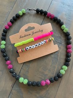 Elevate your party-ready look with our vibrant Party Animals bracelet set! Handmade with love, these dynamic accessories feature a vibrant combination of hot pink, lime green, and sleek black beads. Don't fade into the background - stand out in style and unleash your inner Party Animal at every ball game! And that's not all! This listing also includes a dazzling Party Animals bling necklace, adorned with pink, green, and black round rhinestone beads, ensuring you stand out from the crowd. 🙊⚾️🎉 Playful Black Beaded Bracelets With Letter Beads, Trendy Black Birthday Bracelets, Casual Green Jewelry For Party, Fun Black Jewelry For Birthday, Black Party Bracelet With Letter Beads, Black Letter Beads Bracelet For Party, Neon Yellow Trendy Jewelry For Party, Fun Black Beaded Bracelets With Round Beads, Black Letter Beads Bracelets For Parties