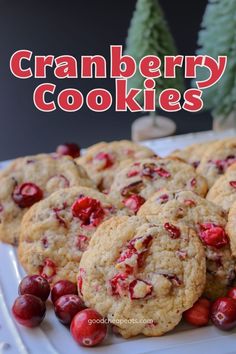 cranberry cookies on a white plate with red berries and text overlay that reads, cranberry cookies