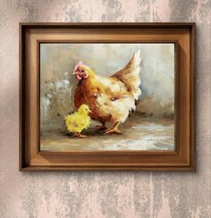 a painting of a chicken and its chickling chicks in a frame on the wall