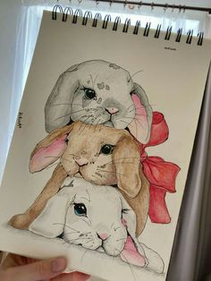 a drawing of two dogs and a rabbit