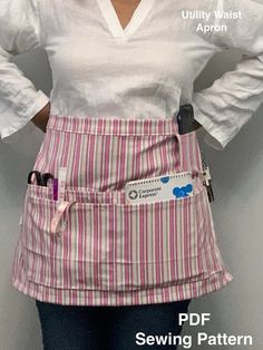 a woman wearing an apron with her hands on her hips