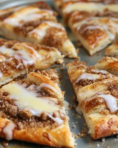 several slices of cinnamon roll with icing on top