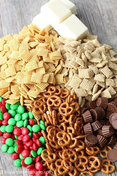 an assortment of cereal, pretzels, and marshmallows on a wooden table