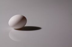 an egg sitting on top of a white table