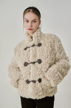 Embrace the cold with the Fluffy Stand Collar Teddy Jacket. A blend of chic style and comfort, this jacket comes with a unique stand collar that provides an enhanced sense of warmth, ensuring a snug feel during chilly days. Its length falls right at the hip, emphasizing a flattering silhouette. Cozy Beige Outerwear With Button Closure, Winter Outerwear With Button Cuffs For Cold Weather, Fall Outerwear With Buttons And Stand Collar, Beige Buttoned Outerwear For Cold Weather, Beige Outerwear With Button Closure For Cold Weather, Beige Buttoned Outerwear For Winter, Winter Pea Coat With Stand Collar And Button Closure, Cozy Outerwear With Buttons For Cold Weather, Fall Cream Outerwear With Stand Collar