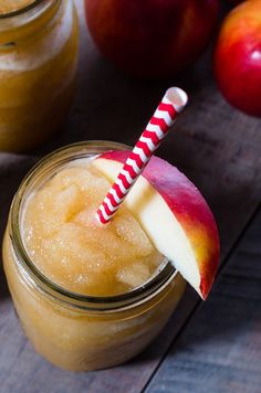 an apple pie smoothie in a mason jar with a striped straw