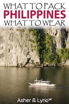 a boat floating on top of a body of water next to a rocky cliff face