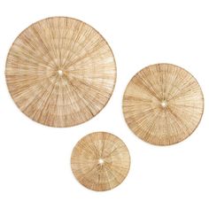 three round bamboo coasters on a white background