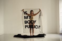 a woman holding up a scarf with the words is my body public?