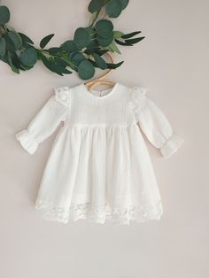 ♡ This is handmade and unique girl dress below knee-length and with long sleeves.  It is breathable, natural, comfortable to wear on special occasions. ♡ MADE OF: Ecru double gaze muslin with ecru lace (it's pure 100% ECO Organic Cotton) and wooden button. ♡ Processing time: ready to ship.  ♡ CARE INSTRUCTIONS: Wash in cold or warm water (30oC/ 65 - 85F). Do not use bleach. Dry at low temperatures, do not use machine drying. Iron at medium or low temperature. Hand wash and hang dry for longer we Formal Frocks, Baptism Dress Baby, Boho Baptism, Baby Baptism Dress, Baptism Dress Baby Girl, Girls Long Sleeve Dresses, Muslin Dress, Dress Baby Girl, Baptism Gown