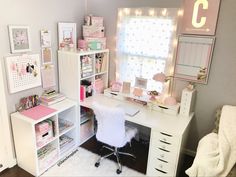 a white desk topped with lots of drawers next to a window