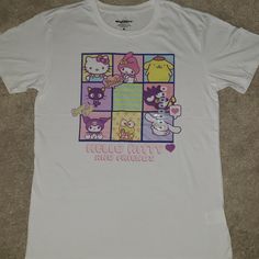 This Listing Is For A New With Tags (Nwt) Hello Kitty And Friends T-Shirt In A Size Medium. This T-Shirt Is In Perfect, Brand New Condition, With No Flaws Whatsoever. It Is Primarily A White Shirt With Pink, Yellow, Blue And Purple Colors In The Main Design. The Design On The Front Of The T-Shirt Shows Hello Kitty Along With All Of Her Friends. The Back Of The T-Shirt Is Just Plain White. The Measurements Are Shown In The Photos. ***I Do Have This Same T-Shirt In A Size Large Available In My Clo White Hello Kitty Print Fun T-shirt, Fun White Hello Kitty Print T-shirt, Fun White T-shirt With Hello Kitty Print, White Hello Kitty Crew Neck T-shirt, White Hello Kitty Print Crew Neck T-shirt, White Kawaii Hello Kitty Top, White Cotton Hello Kitty Top, White Crew Neck T-shirt With Hello Kitty Print, White Hello Kitty Cotton T-shirt