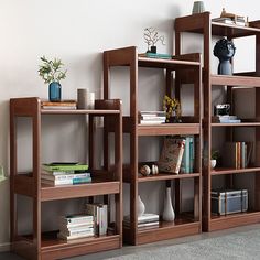 the bookshelf is made of wood and has many shelves