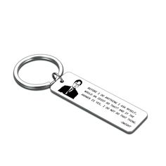 a metal keychain with a quote on it