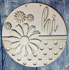 a wooden sign that says hi with flowers on it