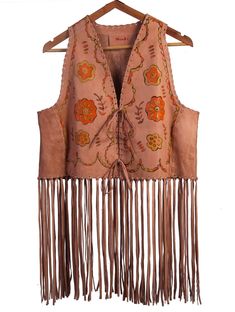 Introducing our 70's vintage-inspired, hand-painted leather fringe vest. This vest is crafted from genuine goat leather and features unique front hand-painting, adding a touch of artistic flair to this piece. The jacket is also hand-sewn for added durability and quality. It comes in the rich salmon pink color. The vest has a fringe detail on the back, adding an extra touch of bohemian style.  Add a touch of vintage charm to your wardrobe with this one-of-a-kind leather fringe vest. The jacket is available in personalized custom sizes. Please message us for further information. Brown Leather Spring Vest, Brown Leather Vest For Spring, Vintage Wishlist, Leather Fringe Vest, Vintage Leather Vest, Salmon Pink Color, Western Vest, Fringe Vest, Book Clothes