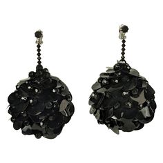 Channel your inner Twiggy with these Massive Mod Sequin Ball Earrings from the 1960's. Huge spheres are hand sewn with resin jet beads and black circular paillettes resembling round pine cones, likely on a foam base. Clip back fittings. Not terribly heavy. 1960's USA. 5" x 3" wide. Sequin Earrings, Sequin Jewelry, Mod Jewelry, Ball Earrings, Pine Cones, Hand Sewn, Hand Sewing, Jewelry Earrings Dangle, Sequin