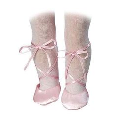 a pair of pink ballet shoes with laces