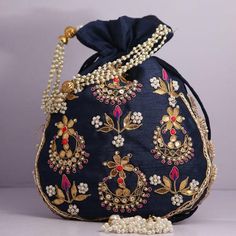 Material:Golden Lace Ribbon, Golden Metallic Wire, Motifs, ThreadColor: Navy Blue, Pink, Pistachio Green, Golden, Bronze, RedSize: 10" x 8"Designed with the heart, this beautiful Potli or batawa bag are eye catchy and made of premium material.Key Features:Embroidery art work. (gotta pati work).This potli is good match with both Indian and western outfits and are superb for wedding and festive parties.This would be best complement to your designer saree, lenhga or any other kind of dress.This is Gold Clutch With Intricate Embroidery, Gold Clutch Bag With Intricate Embroidery, Rectangular Embroidered Shoulder Bag For Celebration, Embroidered Rectangular Shoulder Bag For Celebration, Party Bags With Multicolor Intricate Embroidery, Festive Bags With Gold Embroidery For Gift, Wedding Handheld Potli Bag, Wedding Handheld Potli Gift Bag, Traditional Embroidered Formal Bag