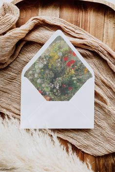 an envelope with flowers on the inside