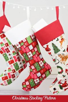 two christmas stockings hanging from a clothes line