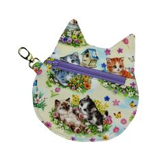 a small purse with kittens and flowers on the front, one has a purple zipper