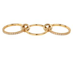 two gold rings with white diamonds on each side and an open loop in the middle