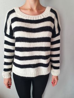 "100% NATURAL YARN  This alpaca blend sweater for women is as soft as a petal. The hand-knitted black and white warm pullover will add character to your daywear. Will look perfect with jeans or trousers. Grunge sweater. Versatile, soft, casual style.  Ethically hand-made in Bulgaria. READY TO SHIP Composition: 60% wool 20%mohair 20%alpaca SIZE & FIT * Relaxed fit, scoop neck * Model is 170cm (5'5\") and is wearing size S/M The knit comes in one size and Can fit sizes S and M depending on the des White Knitted Alpaca Sweater, Oversized Hand Knitted Black Sweater, White Hand Knitted Alpaca Sweater, Black Oversized Hand Knitted Sweater, Casual White Hand-knitted Sweater, Casual White Hand Knitted Sweater, White Crew Neck Knitting Pattern, White Crew Neck Hand Knitted Pattern, Black Long Sleeve Knitted Sweater