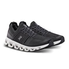 the on cloud running shoe in black and white