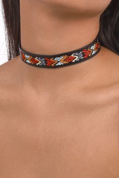 Add some quirky fun to your wardrobe with our Embroidery Pattern Vegan Leather Choker Necklace. Showcasing playful embroidered designs on sleek vegan leather, this necklace is sure to make a statement and add a unique touch to any outfit. Color: Black Style: PU Choker Necklaces Clasps: Hidden Button Necklace Length: 16.73'' Material: PU Leather,Embroidery Choker Design, Cord Choker, Leather Embroidery, Adventurous Women, Embroidered Designs, Leather Choker Necklace, Button Necklace, Necklace Clasps, Leather Chokers