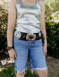 Our Marvel Concho Belt is inspired by the original Marvel line and handcrafted to honor the Marvel family. Featuring beautiful, sterling silver conchos, it’s a bold show-stopper any cowgirl would be proud of! Handcrafted with high quality leather, Mexico silver. S/M: 38" long L/XL: 41" long * This item is excluded from any and all discount codes* Classic Concho Belt Buckles, Silver Concho Belts For Festivals, Silver Concho Belt For Festival, Western Style Silver Belt Buckle, Festival Silver Belt With Concho Details, Festival Silver Concho Belt, Silver Leather Concho Belt Buckles, Silver Concho Belt Buckles For Festival, Classic Silver Concho Belt