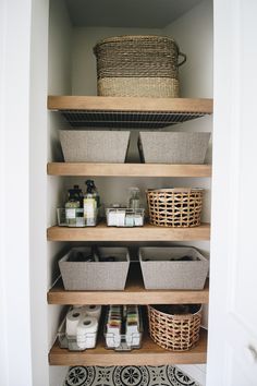 an organized pantry with baskets and toiletries