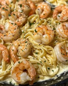 pasta with shrimp and parmesan cheese in a skillet, ready to be eaten