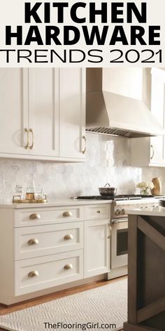 a kitchen with white cabinets and an oven in the center, along with a rug on the floor