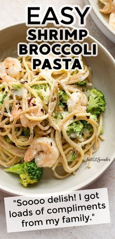 a bowl of pasta with shrimp and broccoli in it on top of a table