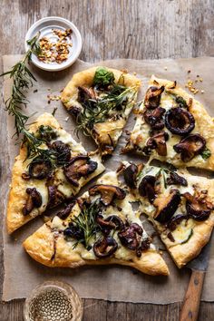 a pizza sitting on top of a wooden cutting board