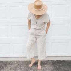 Khaki Cloth & Stone Linen Jumpsuit Look Boho Chic In This Relaxed Fit Cloth & Stone Linen Jumpsuit, Featuring A V-Neck Front And Back, Tie Waist, Hip Pockets, Split Bottom Wide Leg And Button Up Front. Summer Cream Overall Jumpsuits And Rompers, Casual Cream Jumpsuits And Rompers For Summer, Relaxed Fit Jumpsuits And Rompers For Beach Loungewear, Casual Beige Jumpsuits And Rompers For Beach, Fitted Linen Jumpsuits And Rompers For Spring, Spring Fitted Linen Jumpsuits And Rompers, Beach Season Loungewear Jumpsuits And Rompers With Relaxed Fit, Beach Season Jumpsuits And Rompers, Neutral Casual Jumpsuits And Rompers For Summer