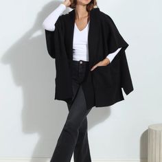 Black One Size Brand New Poncho Black Cape-style Outerwear For Work, Oversized Black Cape For Spring, Black Oversized Cape For Spring, Chic Oversized Cape With Batwing Sleeve, Black Long Sleeve Poncho For Spring, Spring Long Sleeve Black Poncho, Chic Black Cape For Spring, Chic Oversized Outerwear With Batwing Sleeve, Spring Black Outerwear With Batwing Sleeves