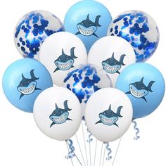 blue and white balloons with sharks on them