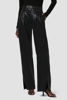 Description Re-up with our High-Rise Rosie Trouser, cut with an elevated waistline, front pleats, center seam and hem slits. The wide leg pant has a ’70s-feel, roomy leg crafted from luxe Illusion vegan leather in Black. Product Details Front Rise: 11.75", Leg Opening: 20, Inseam: 31"Model Height 5'9"Model wearing size 25Measurements based on size 27 Fit & Care Content: 100% PU Face, 100% Polyester BackMachine wash cold with like colorsDo not bleachTumble dry low or hang to dry Chic Black Wide Leg Pants With Pressed Crease, Chic Evening Bottoms With Straight Hem, Black Wide Leg Pants With Pressed Crease, Chic Full-length Bottoms With Seam Detailing, Chic Full Length Bottoms With Seam Detailing, Sleek Full Length Wide Leg Pants With Belt Loops, Chic Black Bottoms With Seam Detailing, Black Wide-leg Pants With Pressed Crease, Chic High-waisted Wide Leg Pants With Side Slits