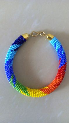 Mothers Gift | Unique Gift | Bracelets | Custom Bracelets | Daughters Gift | Birthday Gift | Gift Idea | Dainty Bracelet | Yoga Bracelets This superbly crafted Rainbow Zulu beaded bracelet is made of fine beads.Main Color - Rainbow.Size - Standard measurement 7.5 - 8 inches (circumference)For smaller and larger bracelets please contact me.Available in different color.Feel free to send me a convo or e-mail for any clarification.Thank you for visiting... Multicolor Braided Bracelet With Round Beads, Multicolor 8mm Beads Jewelry For Crafting, Multicolor Bead Jewelry For Crafting, Multicolor 8mm Beads For Crafting Jewelry, Rainbow Colorful Beads Bracelets, Handmade Multicolor Braided Bracelets, Handmade Rainbow Beaded Bracelets For Gifts, Rainbow Bracelets With Colorful Beads For Crafting, Rainbow Colorful Beads Bracelets For Crafting