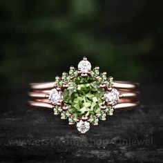 "This is a natural peridot engagement ring in solid gold,about 7mm 1.3ct round cut.  The accent stones are round 3mm moissanites. The matching band stones are round peridot and moissanites. The band width about 1.3-1.4mm. It can be made in any ring size. However please contact me to custom make it to a special big or small size. It can be made in white gold,rose gold or yellow gold with 14k or 18k. However for some people who are nickel allergic,I can also make it to 925 sterling silver to make you can wear it. The ring is handmade,very high quality! 30 days money back guarantee. Returns & Warranty 30-Day money back guarantee (starting from the day of delivery). \"Made to Order\" purchases qualify for our 30-day money back guarantee. The 30-day money back guarantee gives you time to make s Wedding Jewelry With Prong Set Peridot, Wedding Jewelry With Prong Setting And Peridot, Wedding Jewelry With Peridot In Prong Setting, Round Cut Peridot Wedding Jewelry, Wedding Peridot Jewelry Round Cut, Stackable Peridot Wedding Jewelry, Wedding Jewelry With Peridot In Halo Setting, Wedding Stackable Peridot Rings, Round Peridot Three Stone Jewelry