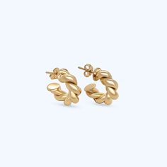 Named after our mother/grandmother, the Barbara twisted earrings are a modern take on a pair of her much loved hoops. Two intertwined polished gold strands create the classic circular shape. **Gold filled 14k gold over brass. *Waterproof. 3 Sizes Barbara diameter is 1.25" Mini Barbara diameter is .75" Huggie diameter is .50" *Waterproof but will be damaged by chlorine and other harsh liquids. **Our gold filled earrings have layers of 14k gold over brass. They have the look and color of solid gol Twisted 14k Gold Earrings, Twisted Gold Plated Yellow Gold Hoop Earrings, Gold Earrings With A Modern Twist, Modern Twist Gold-plated Hoop Earrings, Modern Twist Gold Plated Hoop Earrings, Twisted Yellow Gold Hoop Earrings, Tarnish Resistant, Gold Tarnish Resistant Huggie Earrings With Modern Twist, Gold Huggie Earrings With Modern Twist, Tarnish Resistant, Modern Twisted Jewelry With Polished Finish