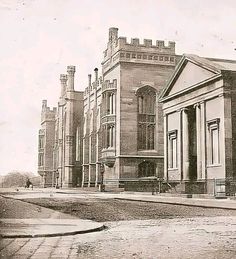 an old black and white photo of some buildings